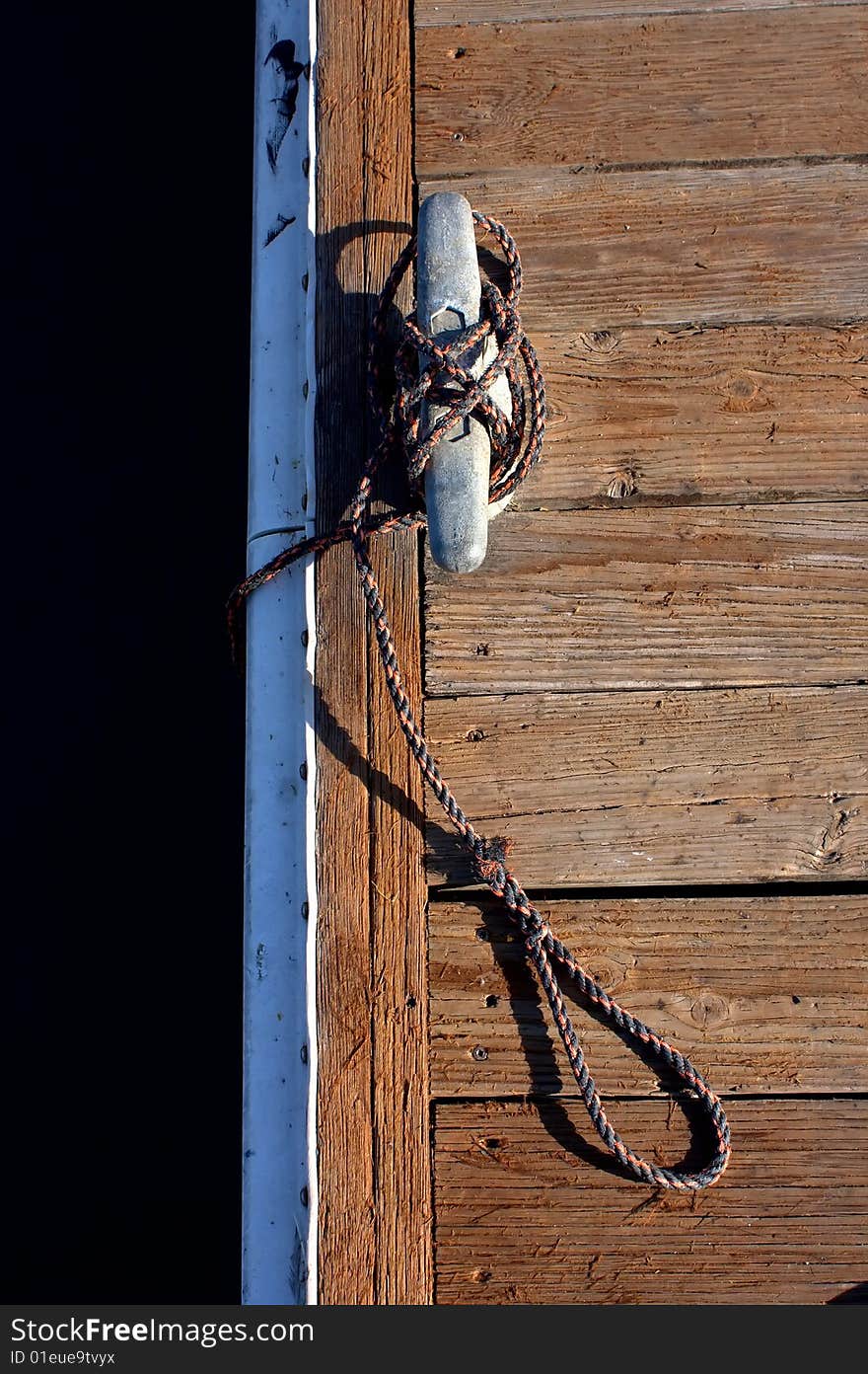 Old anchor on a deck at Half Moon Bay