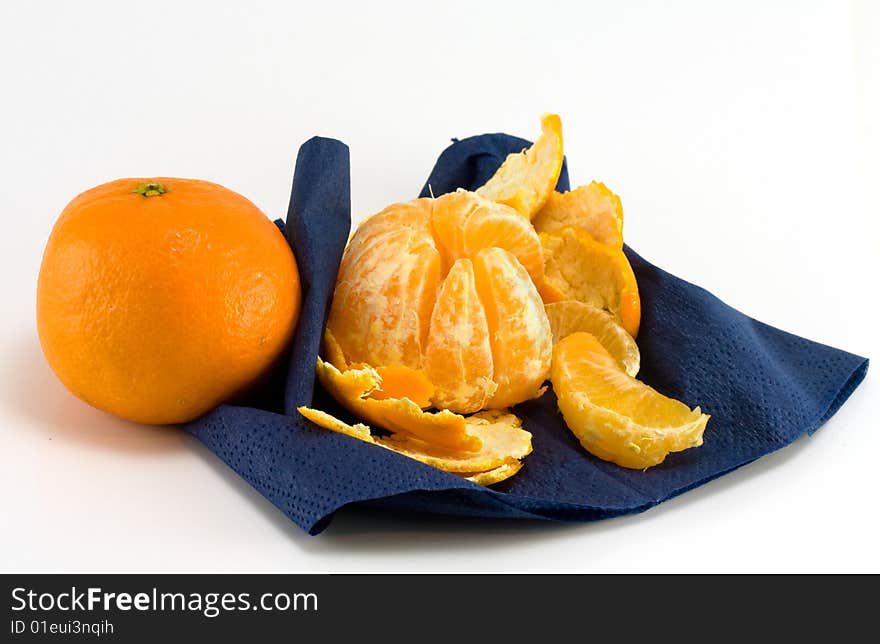 Two mandarines and dark blue serviette