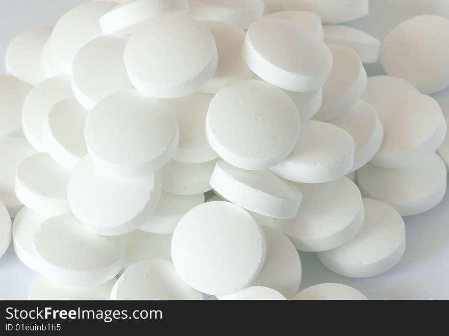 White round pill on the white isolated background