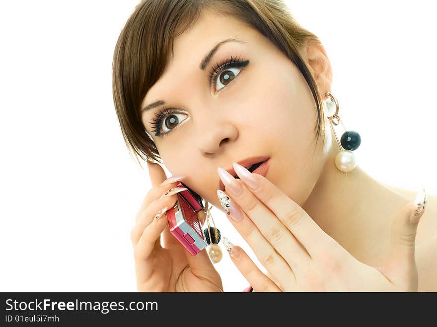 Portrait of a beautiful surprised girl talking on the cell-phone. Portrait of a beautiful surprised girl talking on the cell-phone