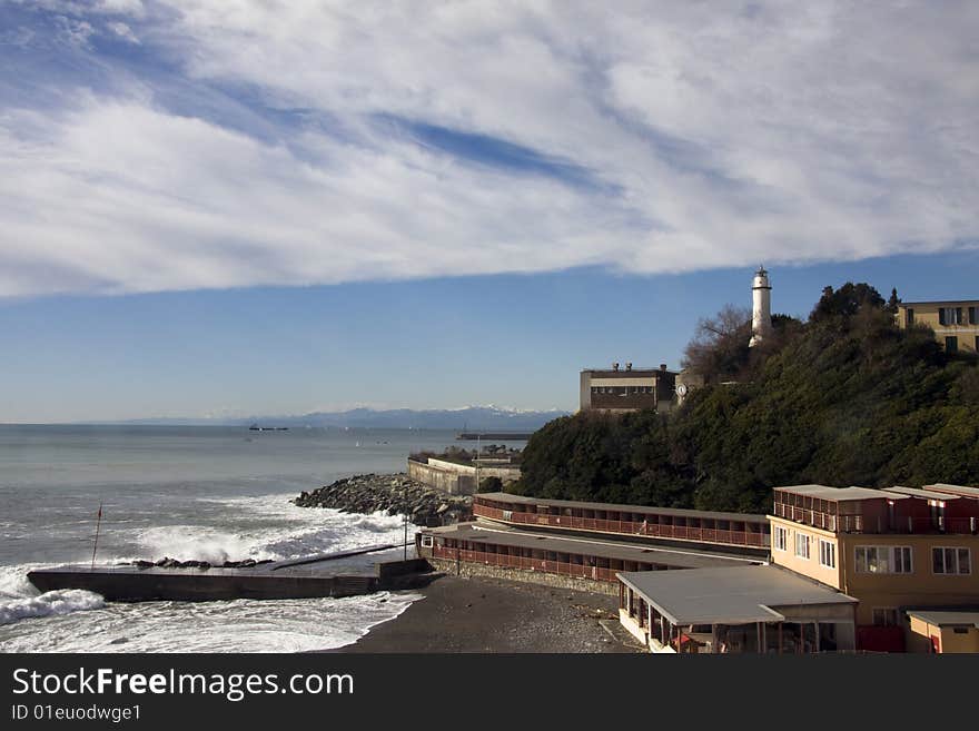 Little lighthouse in Genoa, Italy. This lighthouse is located in popular Corso Italia steet near Boccadasse. The lighthouse rises on a knoll in dominant position, the walk to sea that connects the Fair of the Sea to Boccadasse.