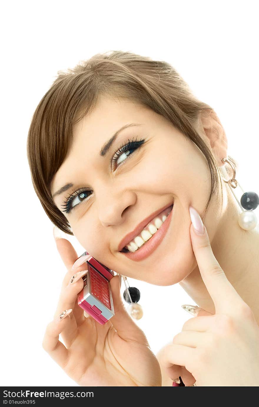 Portrait of a happy young beautiful woman talking on the cellphone