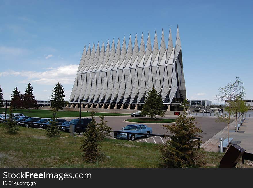 A view of the front entrance and the side of the striking, landmark building that is the U.S. Air Force Academy Chapel, Colorado Springs, Colorado. A view of the front entrance and the side of the striking, landmark building that is the U.S. Air Force Academy Chapel, Colorado Springs, Colorado.