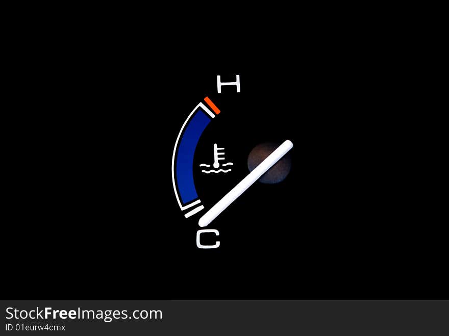Temperature gauge of a vehicle. Isolated on a black background with planty of copyspace. Temperature gauge of a vehicle. Isolated on a black background with planty of copyspace.