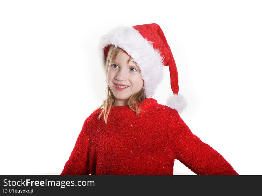 A young girl with a santa hat. A young girl with a santa hat