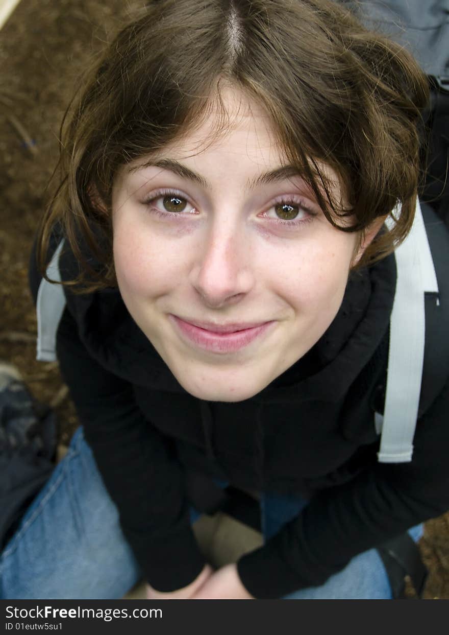 Tired but happy woman on the bench with backpacker. Tired but happy woman on the bench with backpacker.