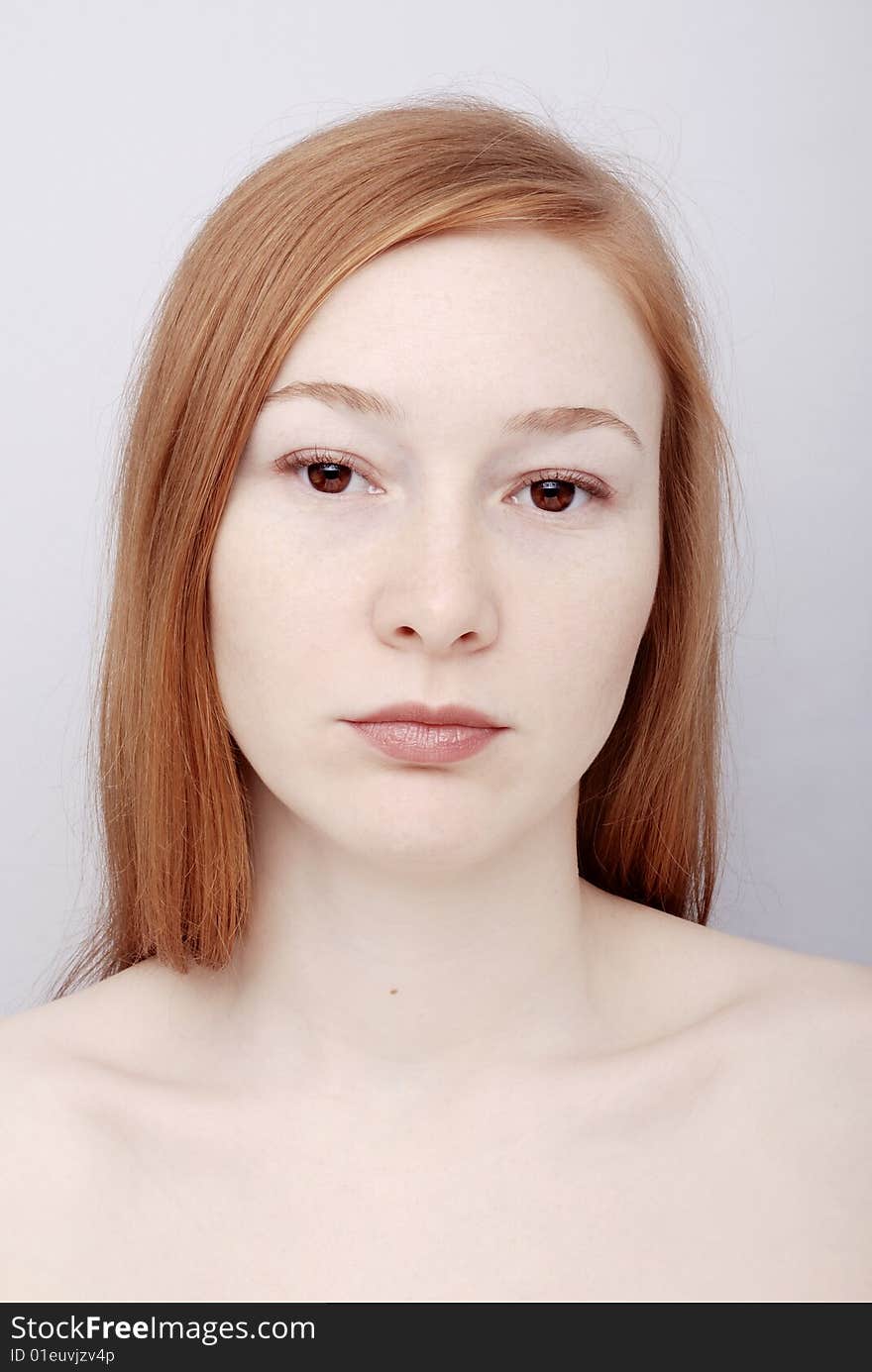 Portrait of the redhead young woman. Portrait of the redhead young woman