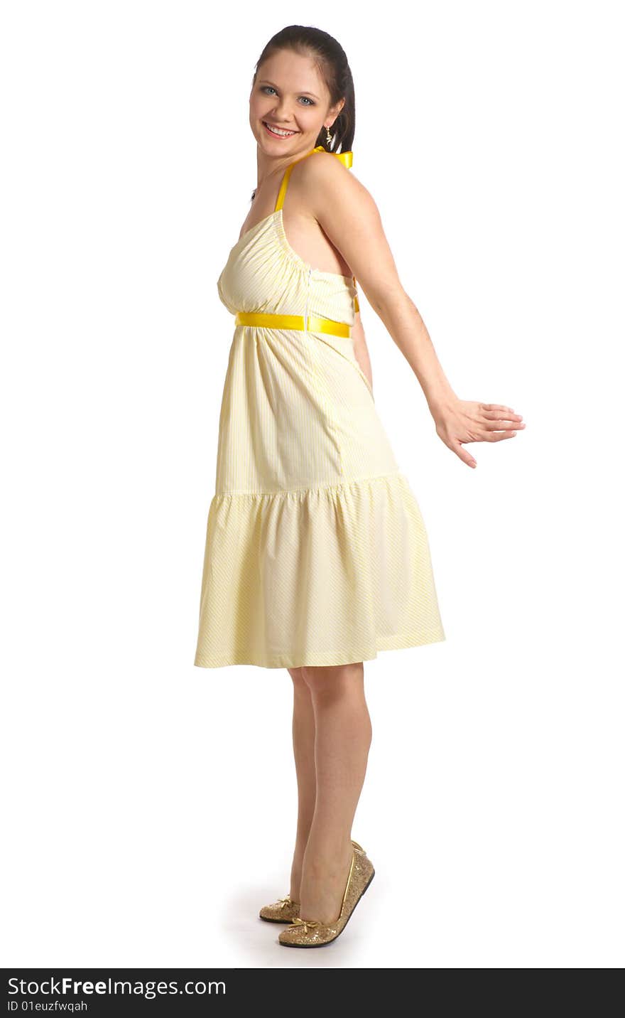 Girl in yellow dress on a white background