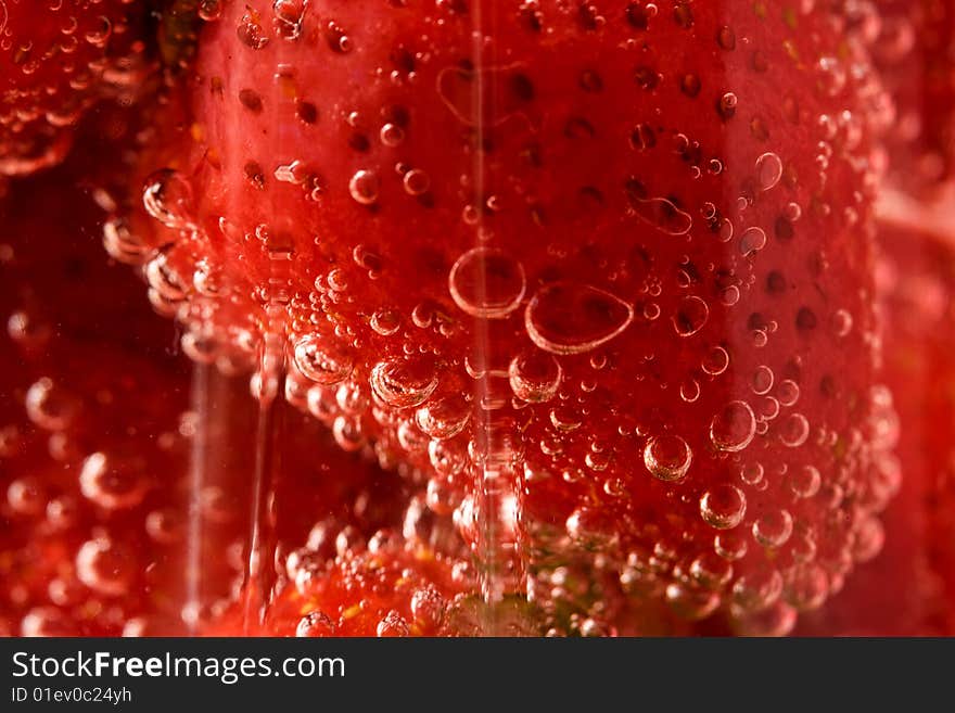 Close up picture of strawberries in glass with water