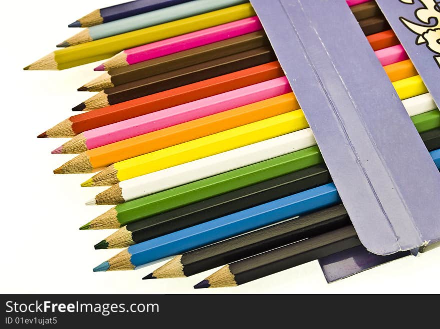 Colorful pencils in box on white