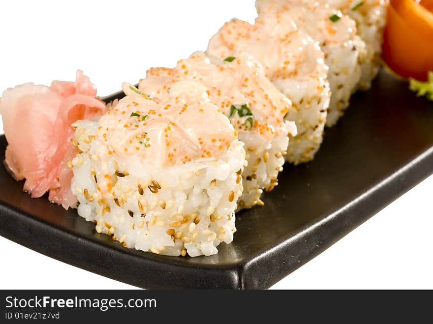 Sushi on a black plate