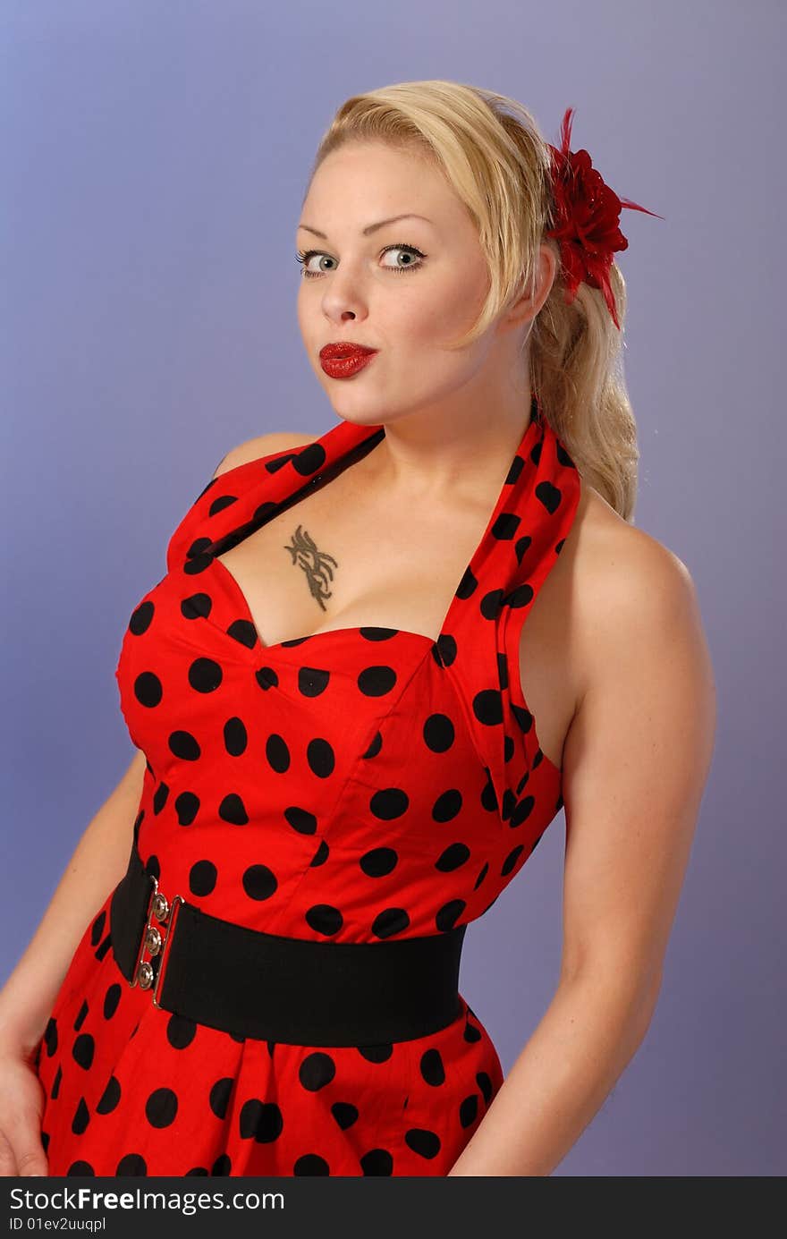 Gorgeous fifties burlesque blond in red polka-dot dress. Gorgeous fifties burlesque blond in red polka-dot dress