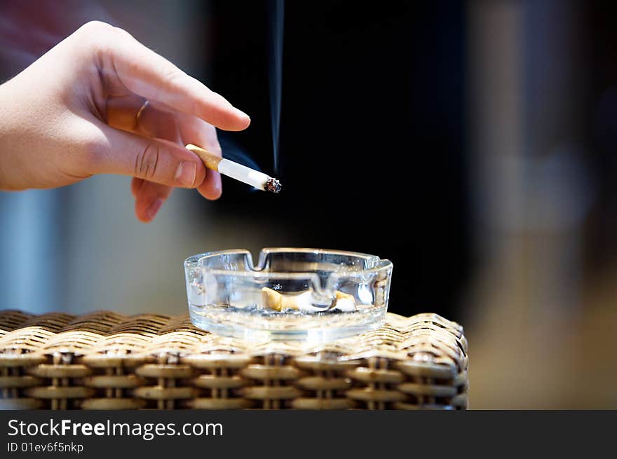 Close up of mens hand holding cigarette. Close up of mens hand holding cigarette