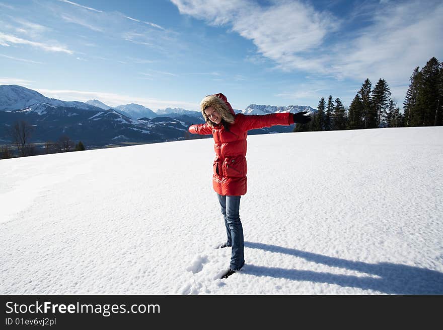 Young cute smiling woman in the show in the mountain. Young cute smiling woman in the show in the mountain