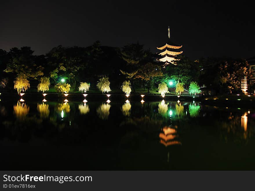 Lightup of five-storet pagoda viewed from Sarusawaike pond, Nara, Japan. Lightup of five-storet pagoda viewed from Sarusawaike pond, Nara, Japan