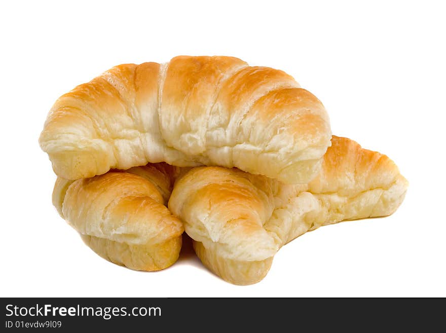 Three fresh Croissants isolated over white background. Three fresh Croissants isolated over white background