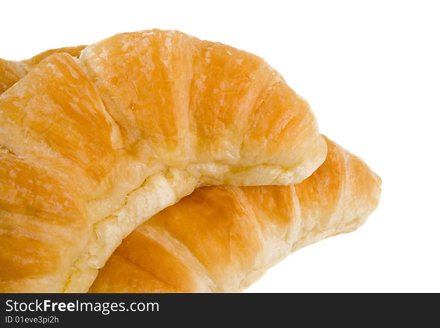 Close up of delicious fresh croissants over white background. Close up of delicious fresh croissants over white background