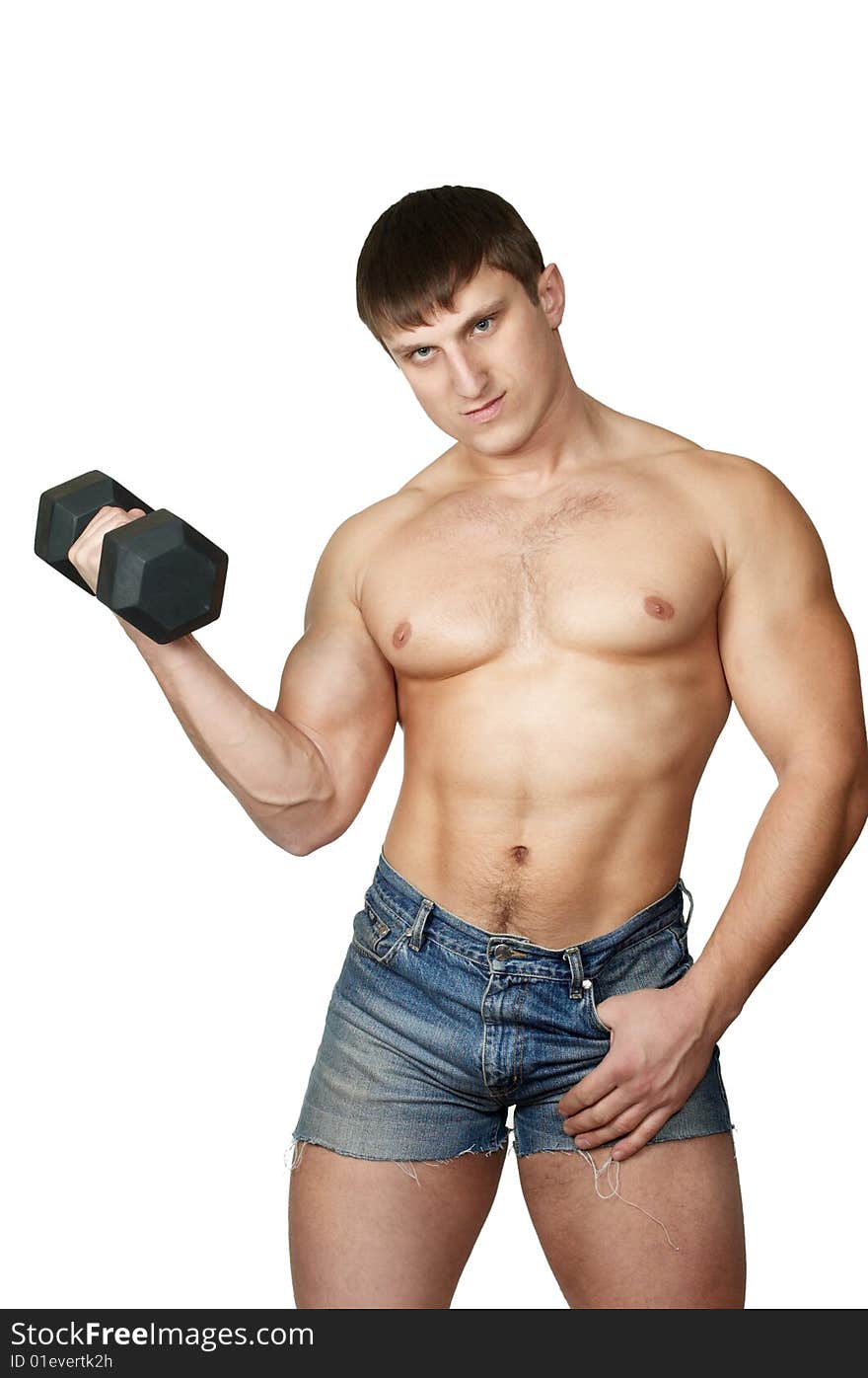 The man does(makes) gymnastic exercises with dumbbell. The man does(makes) gymnastic exercises with dumbbell