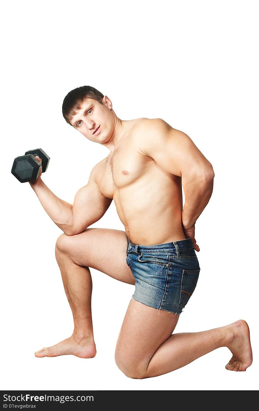 The man does(makes) gymnastic exercises with dumbbell. The man does(makes) gymnastic exercises with dumbbell