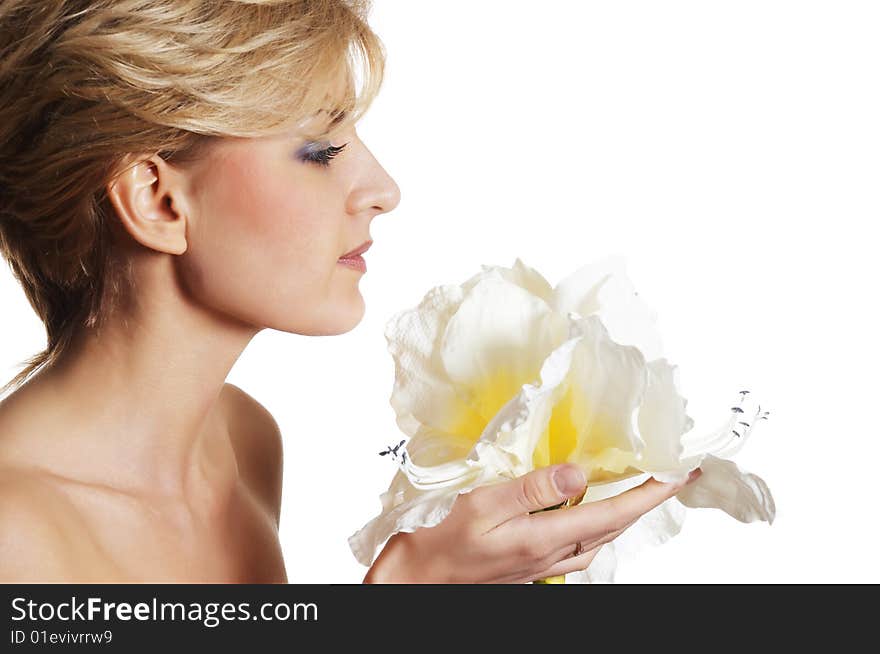 The attractive young girl with beautiful large flower. The attractive young girl with beautiful large flower