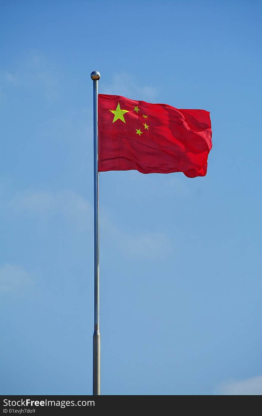 The national flag of China in the wind. The national flag of China in the wind