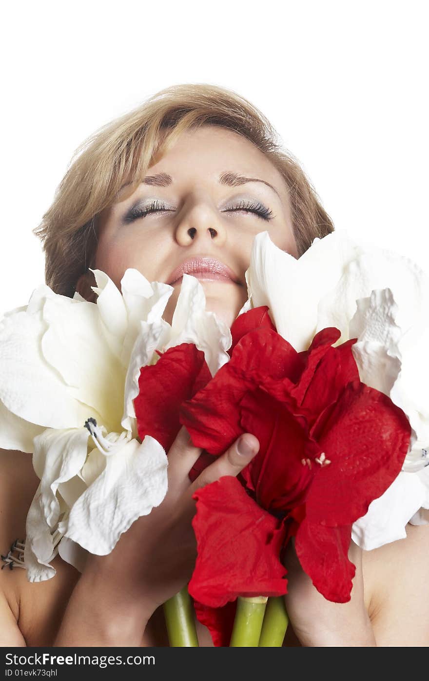 The attractive young girl with beautiful large flower. The attractive young girl with beautiful large flower