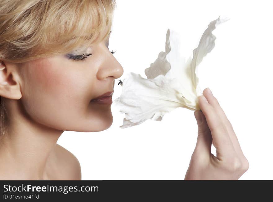 The attractive young girl with beautiful large flower. The attractive young girl with beautiful large flower