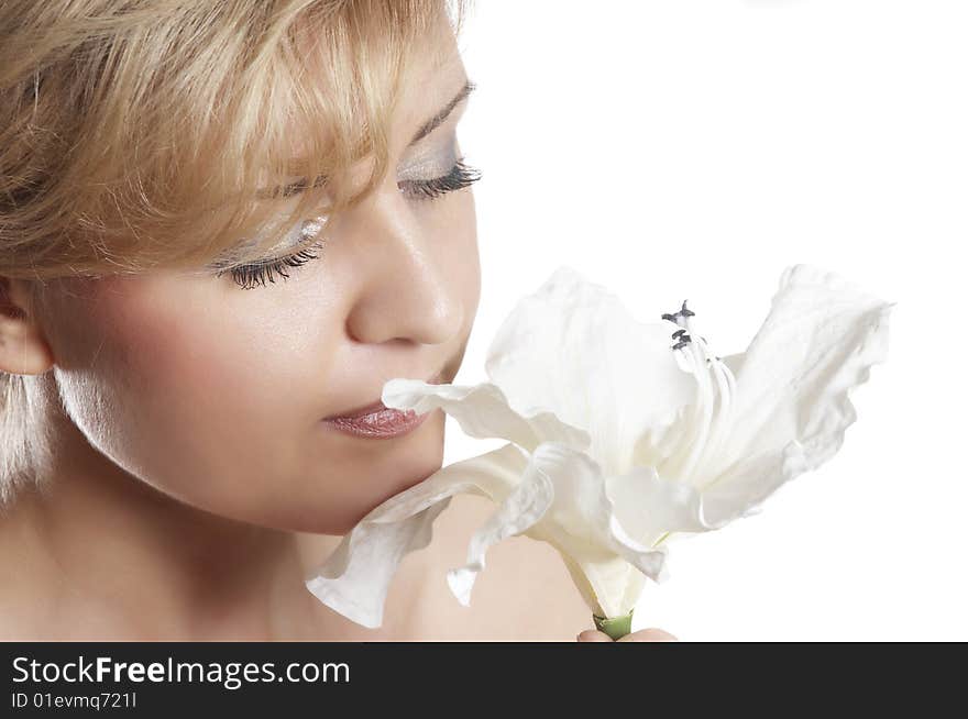 The attractive young girl with beautiful large flower. The attractive young girl with beautiful large flower