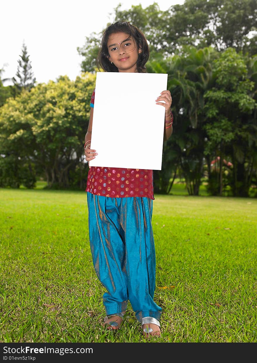 Girl child with blank placard