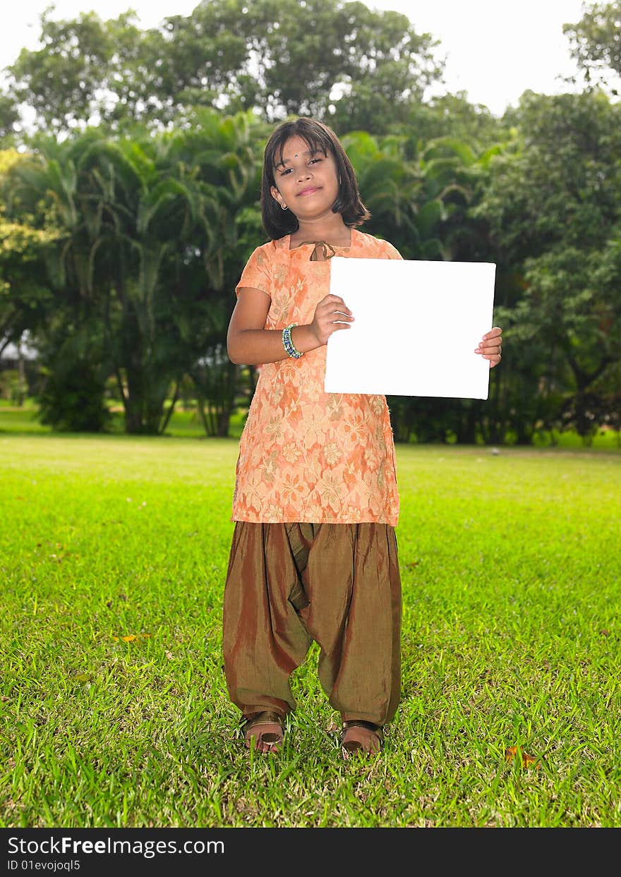 Girl child with blank placard