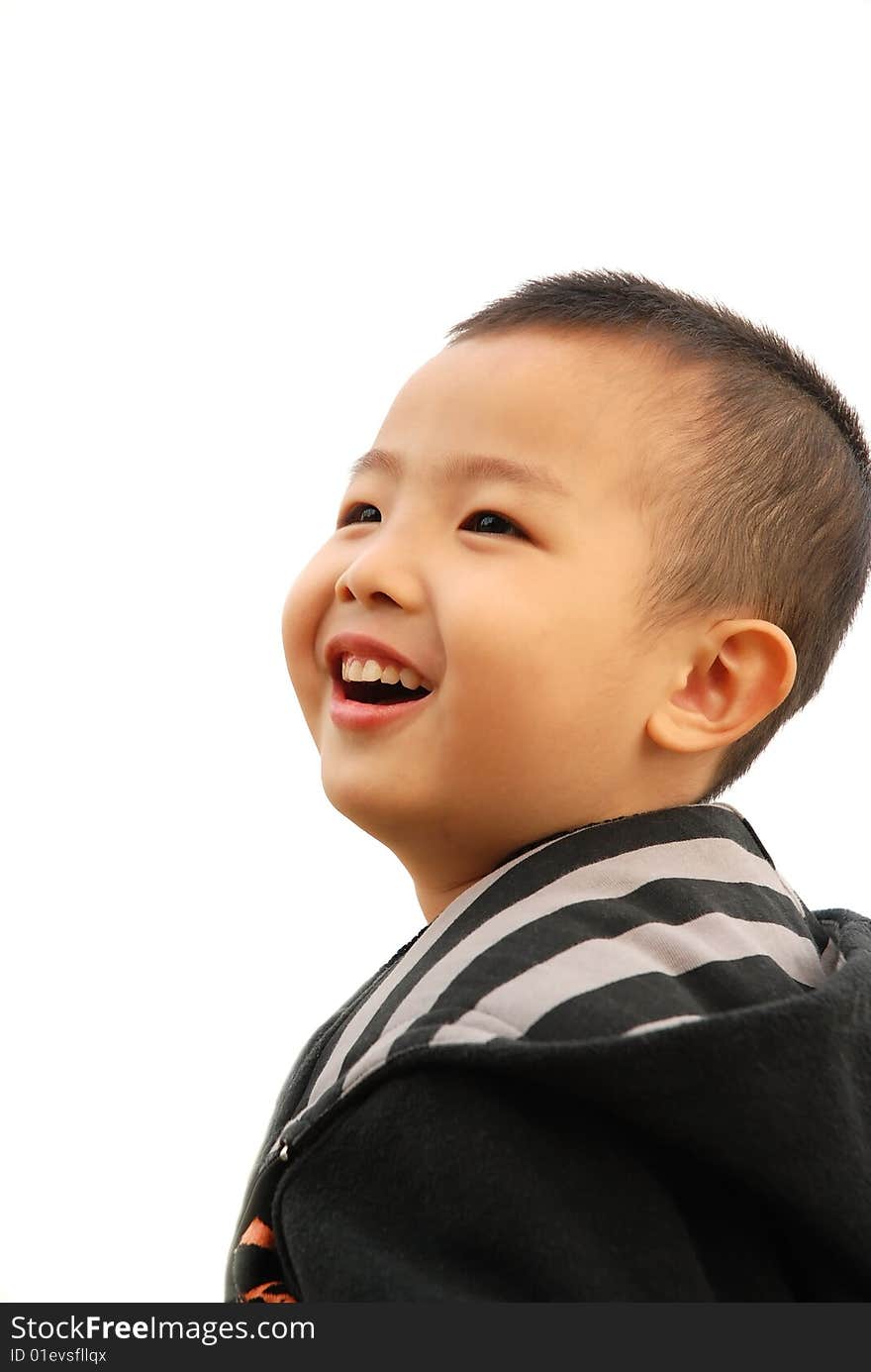 Cute young boy playing cheerfully. Cute young boy playing cheerfully