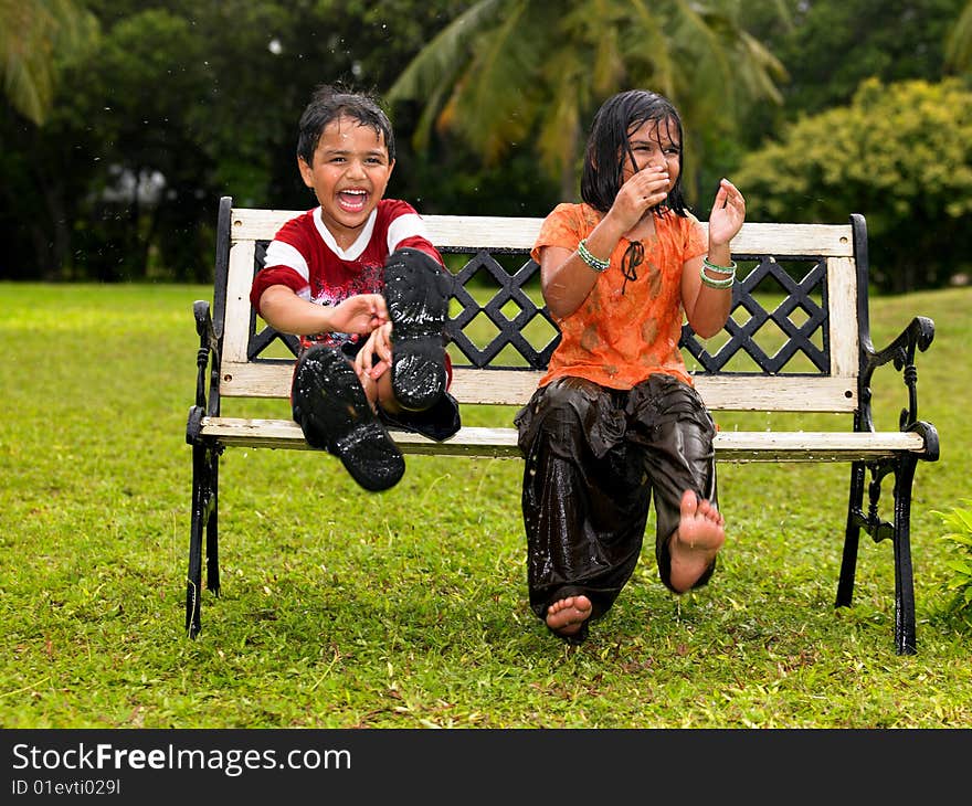 Kids Playing In The Rain