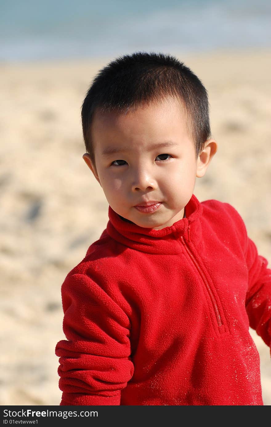 Cute young Boy playing in sunny beach. Cute young Boy playing in sunny beach