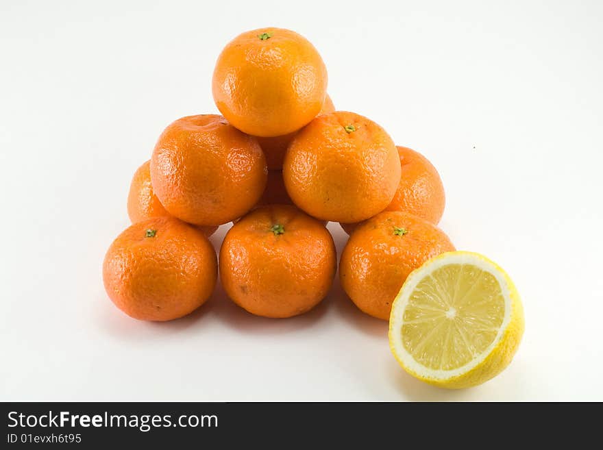 Pyramid from mandarines on white background