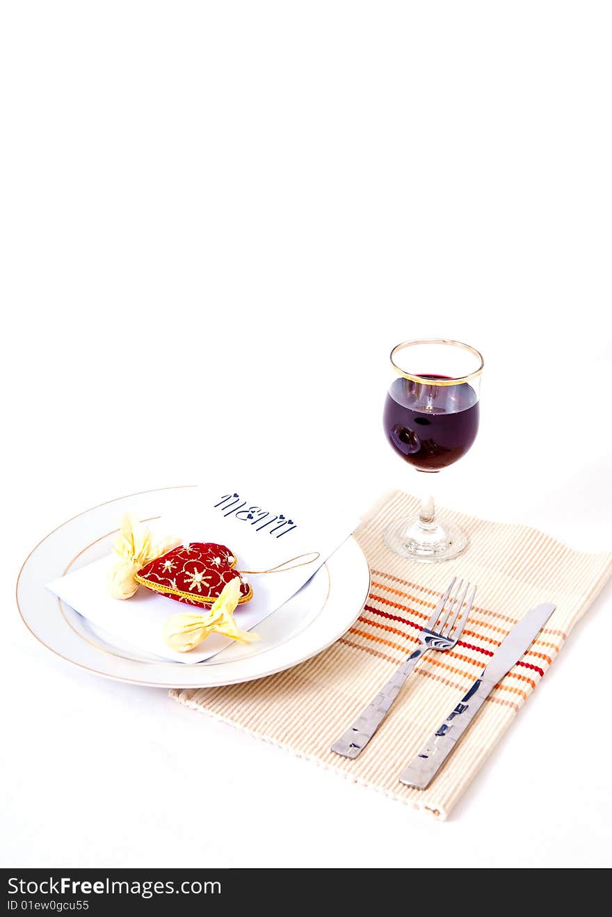 A romantic meal place setting against an isolated background. A romantic meal place setting against an isolated background.