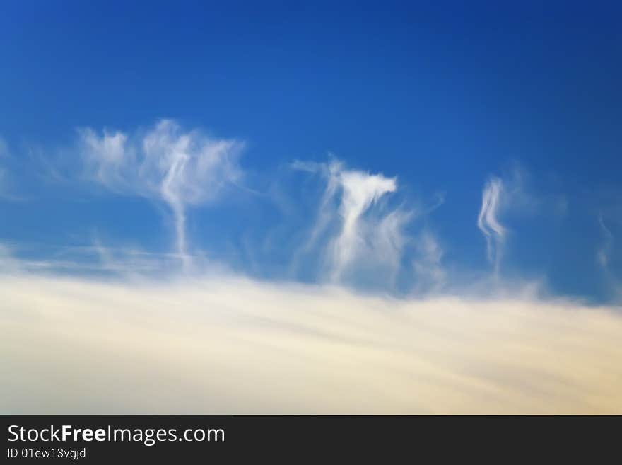 Cloudy mushrooms in the dark blue sky at summer evening. Cloudy mushrooms in the dark blue sky at summer evening.