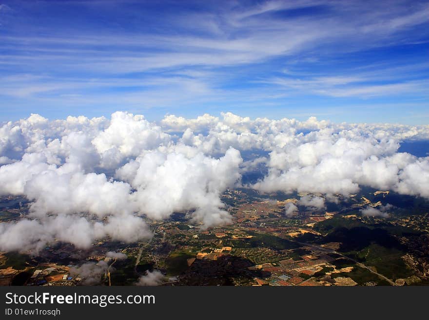 Aerial view of cloudscape over a cityscape.