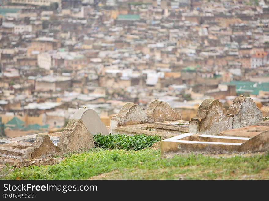 Muslim cemetery with Fes medina view background, Morocco