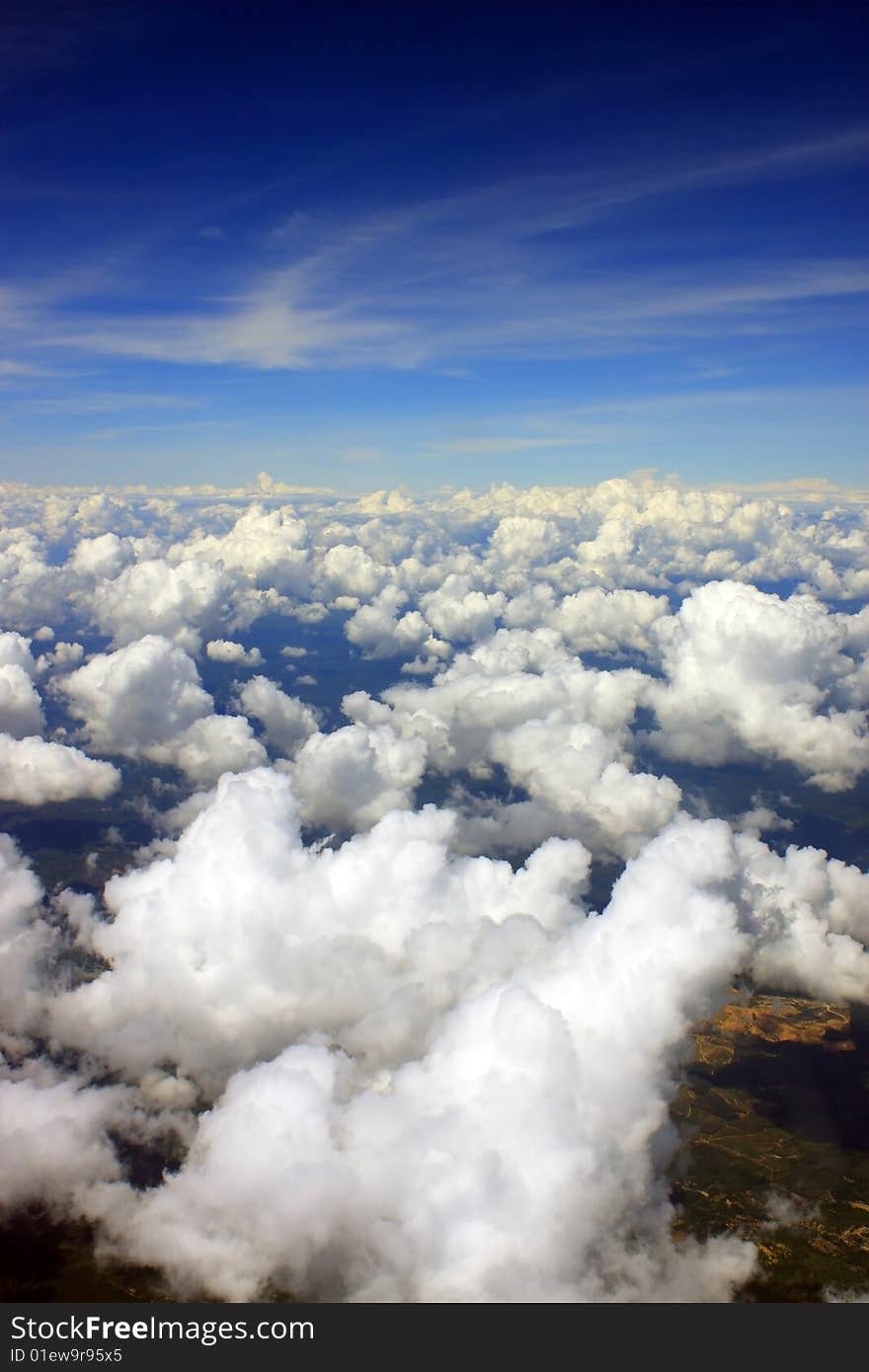 Aerial view of cloudscape over a cityscape.