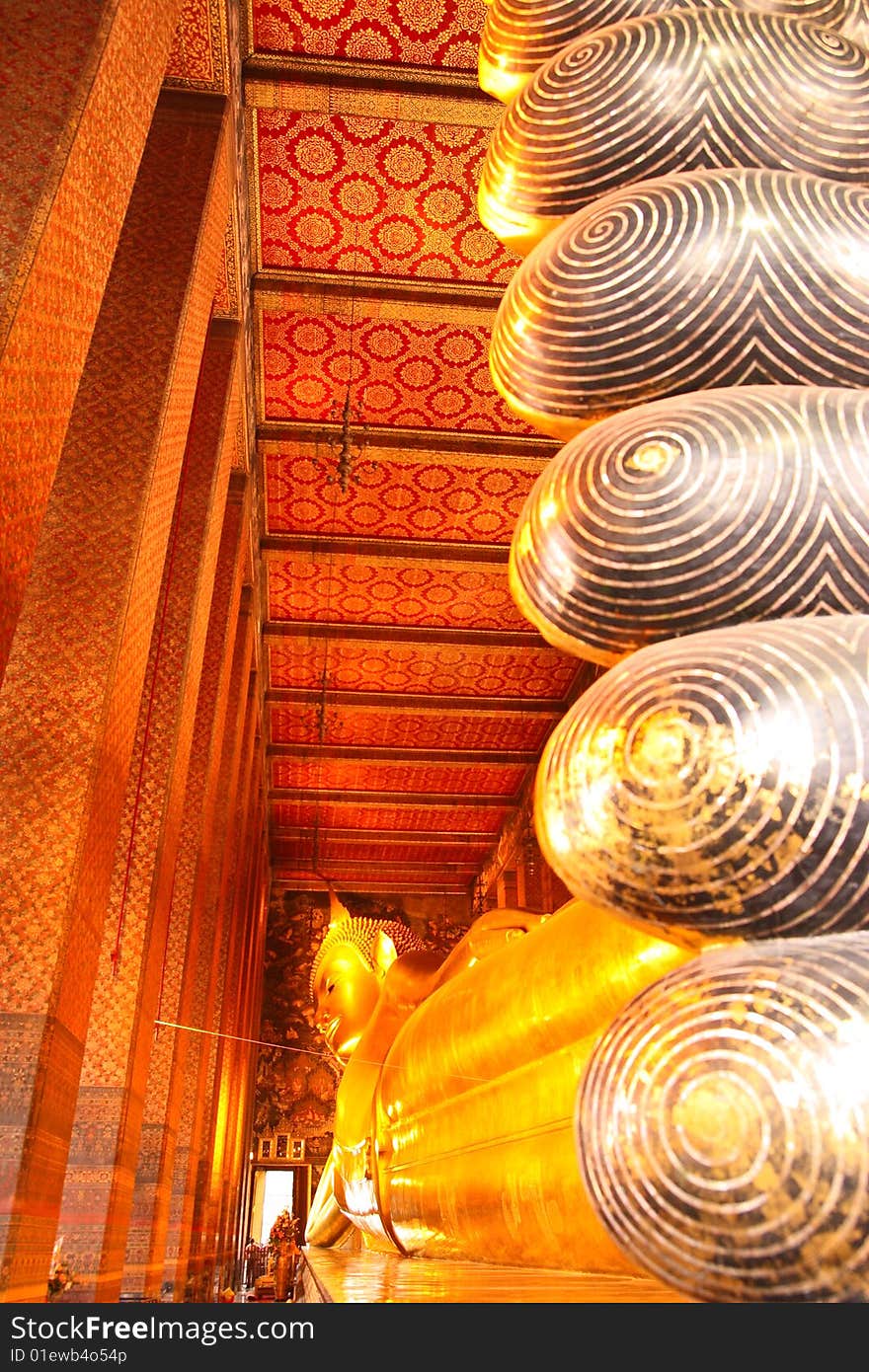 One of the most famous Buddha image in Thailand. The reclining Buddha of Wat Pho, Bangkok, Thailand. One of the most famous Buddha image in Thailand. The reclining Buddha of Wat Pho, Bangkok, Thailand.