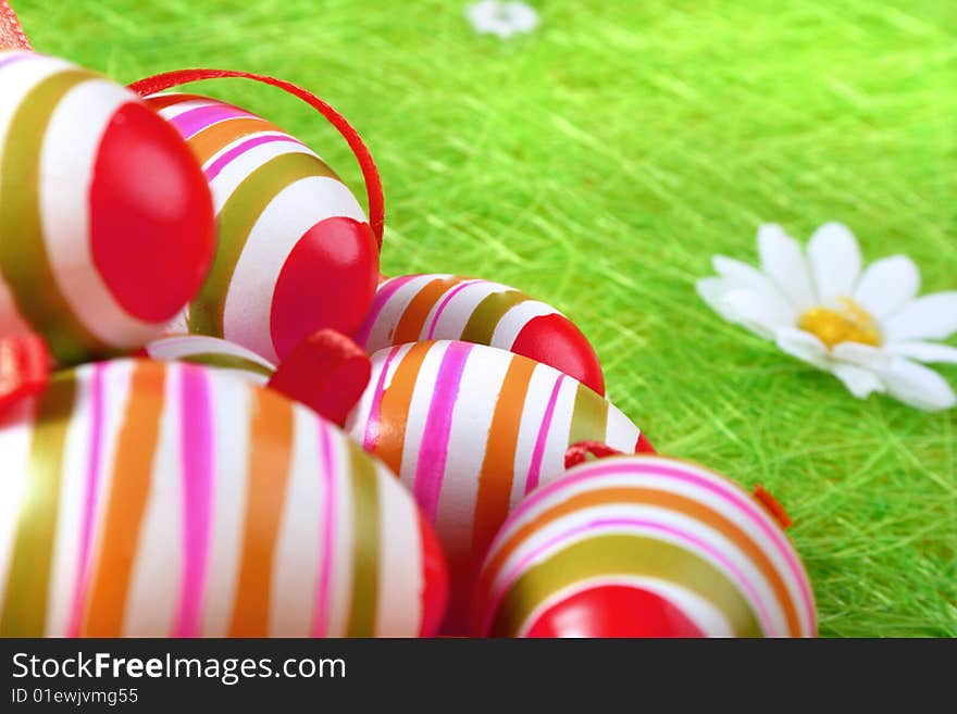 Painted Colorful Easter Eggs on green Grass