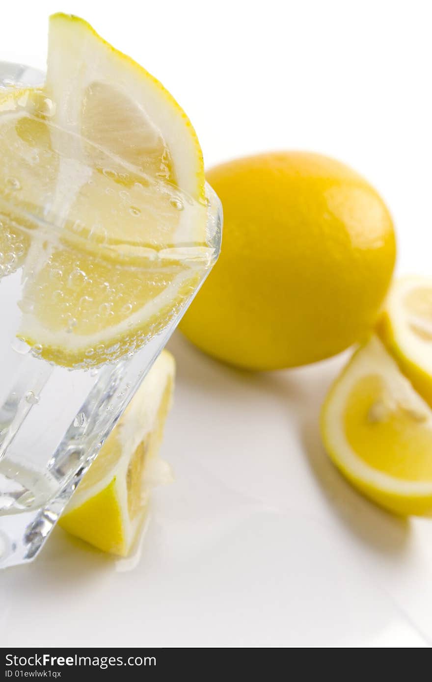 Glass with soda water and lemon slices