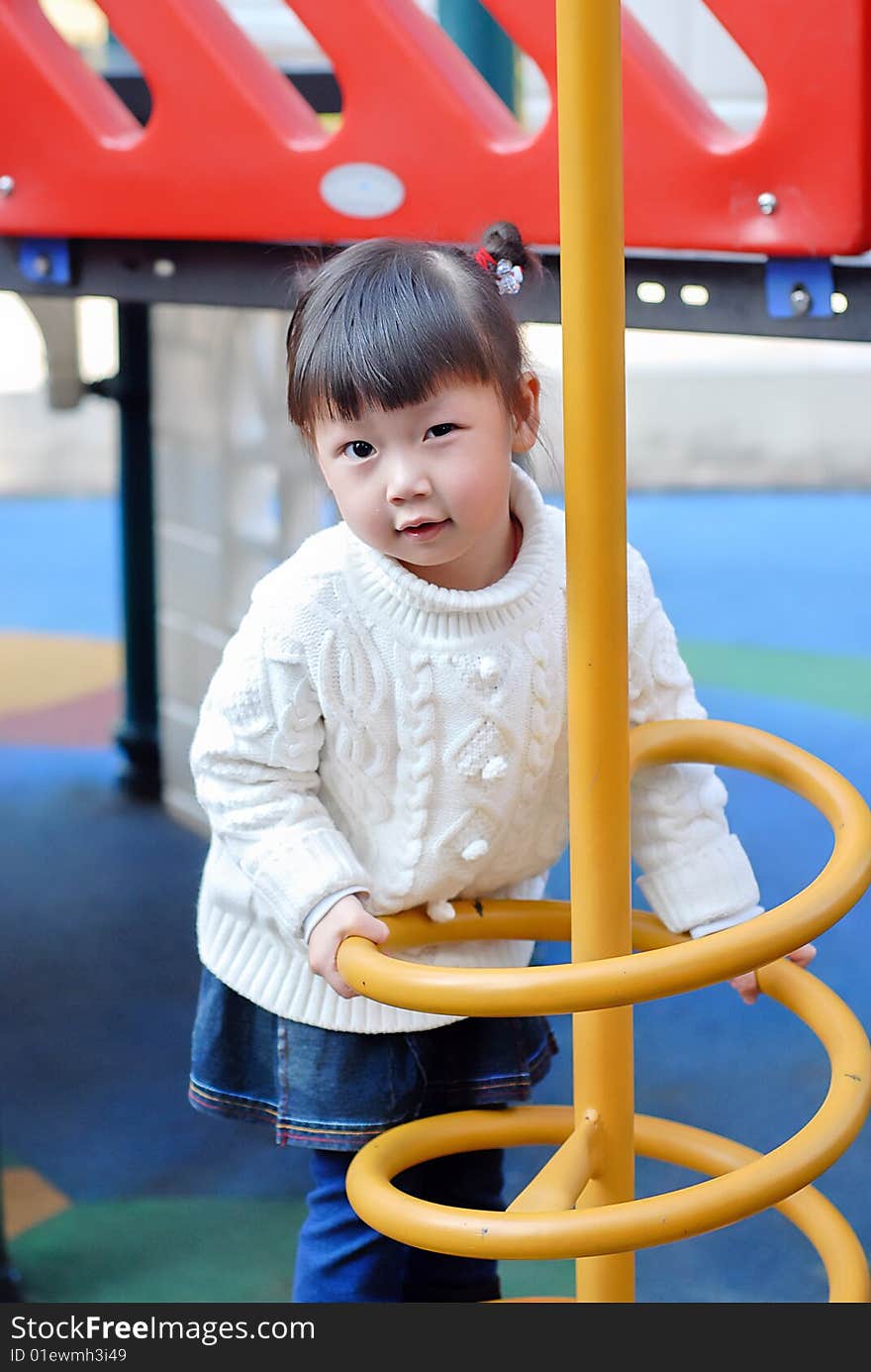 Bright picture of adorable chinese child in the playground. Bright picture of adorable chinese child in the playground