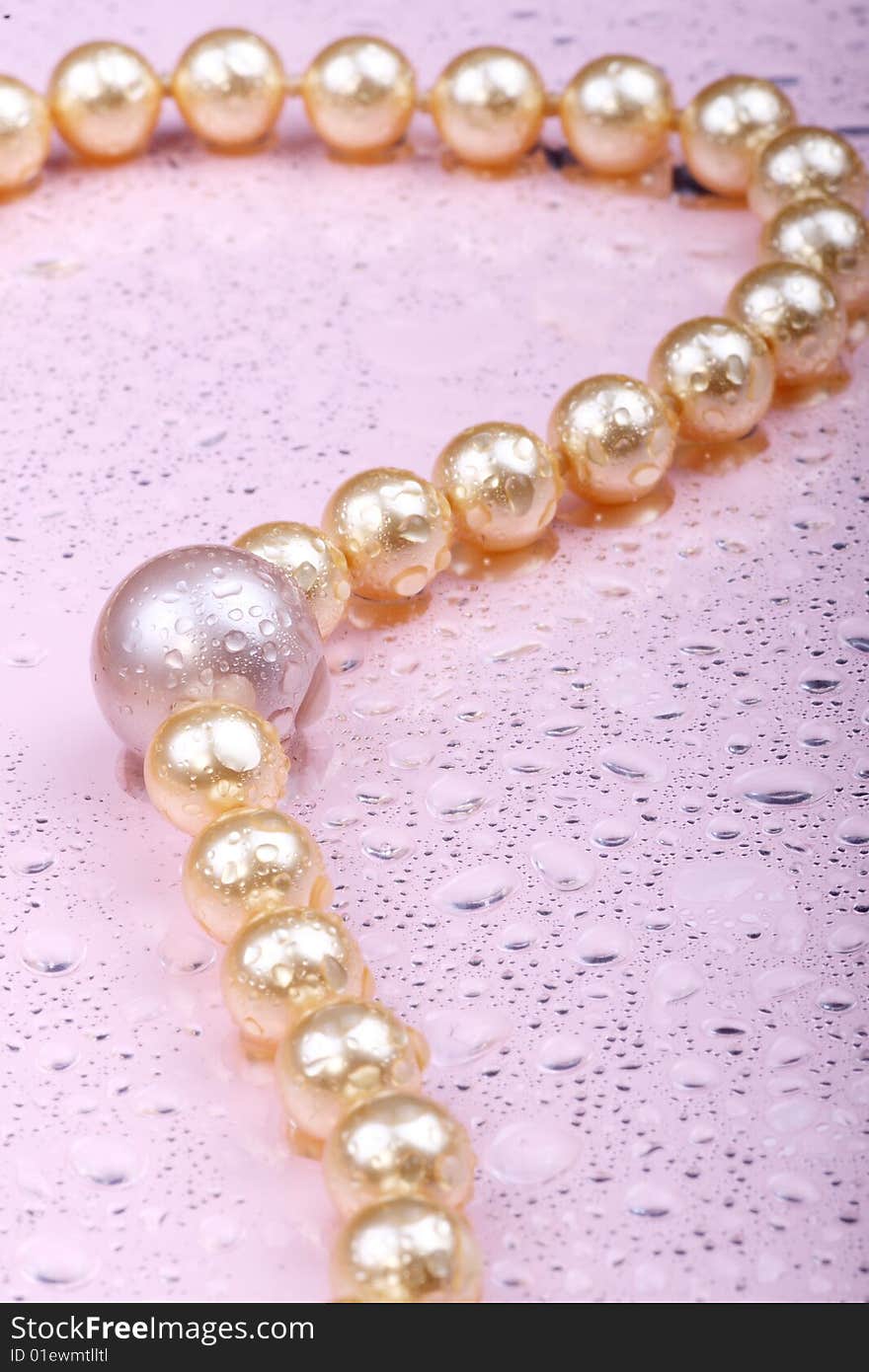 String of pearls on pink background. String of pearls on pink background.