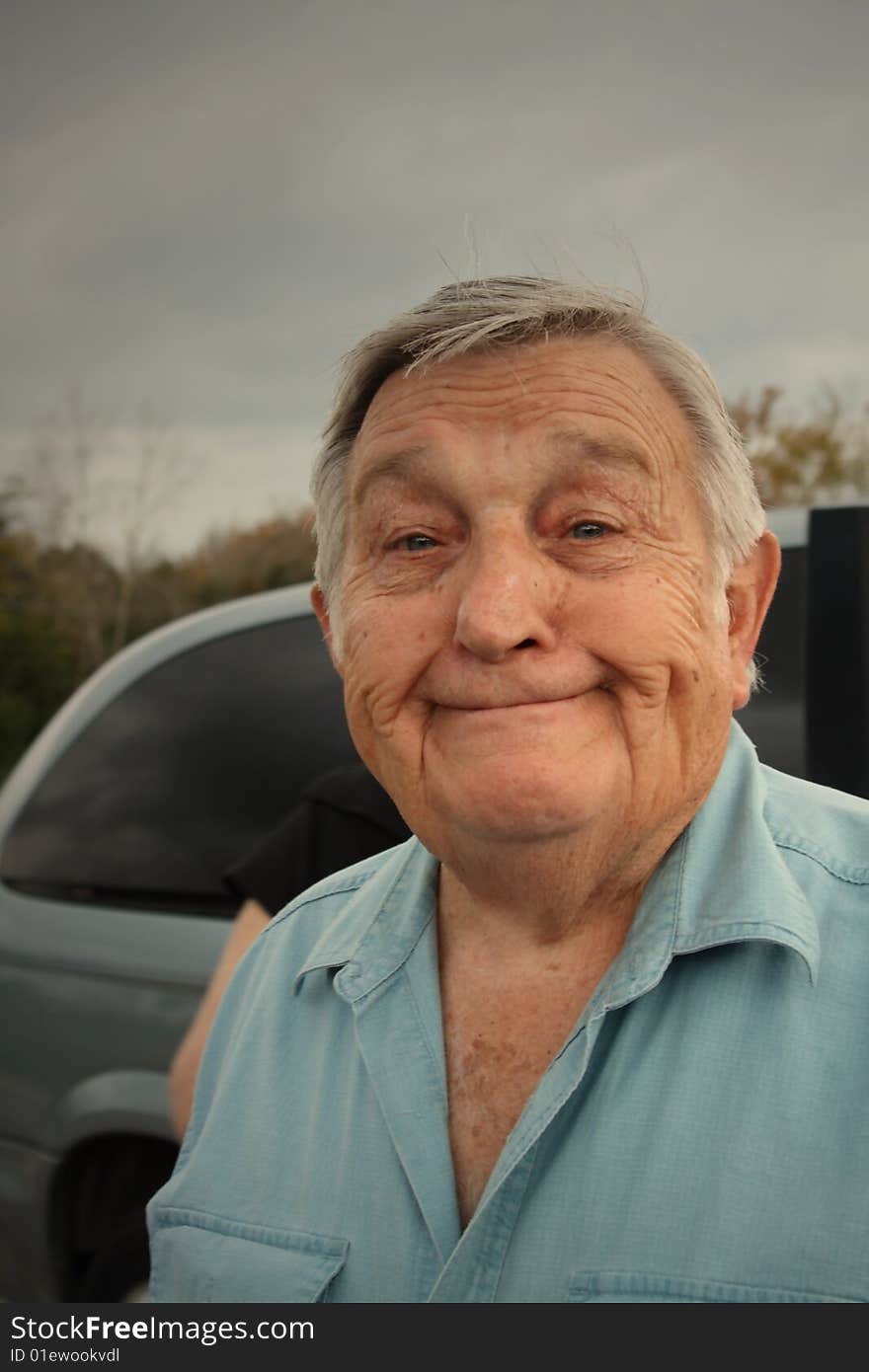 Senior man smiling with gray hair