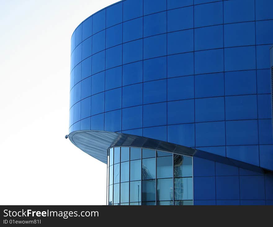 A large blue circular building. A large blue circular building