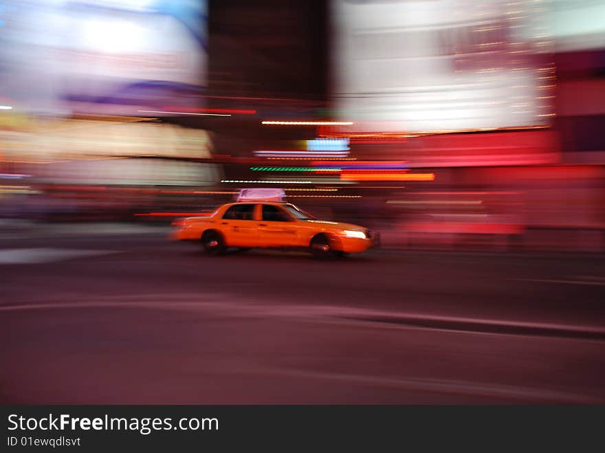 A yellow cab, a New York City icon, speeding through the neon lights of Times Square at midnight. A yellow cab, a New York City icon, speeding through the neon lights of Times Square at midnight