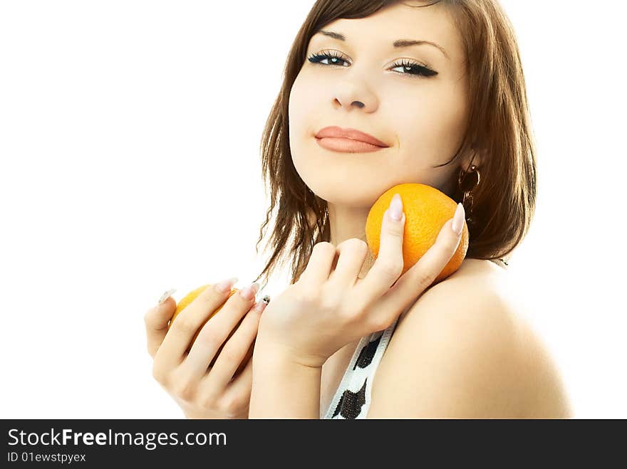 Young brunette woman with oranges