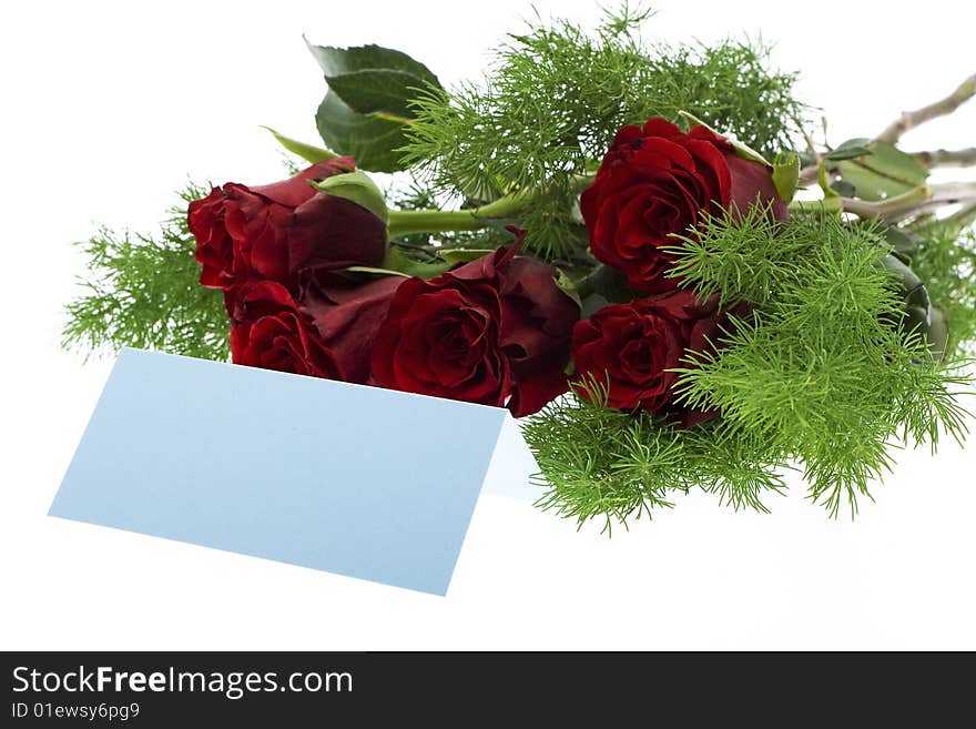 Red roses with a blue place card