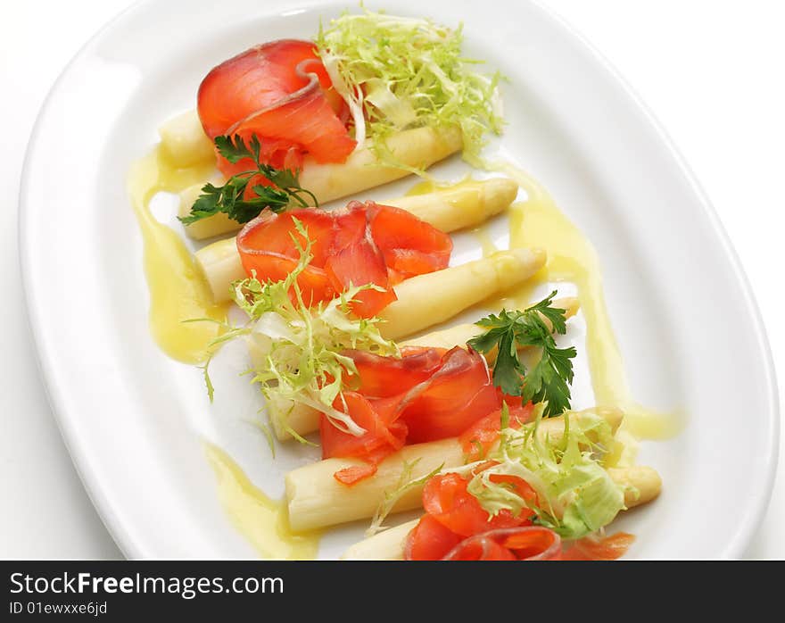 Trout Slice on Asparagus with Vegetables and Greens